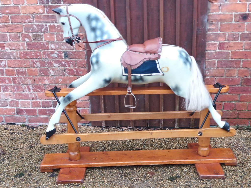 Antique rocking horse by Lines