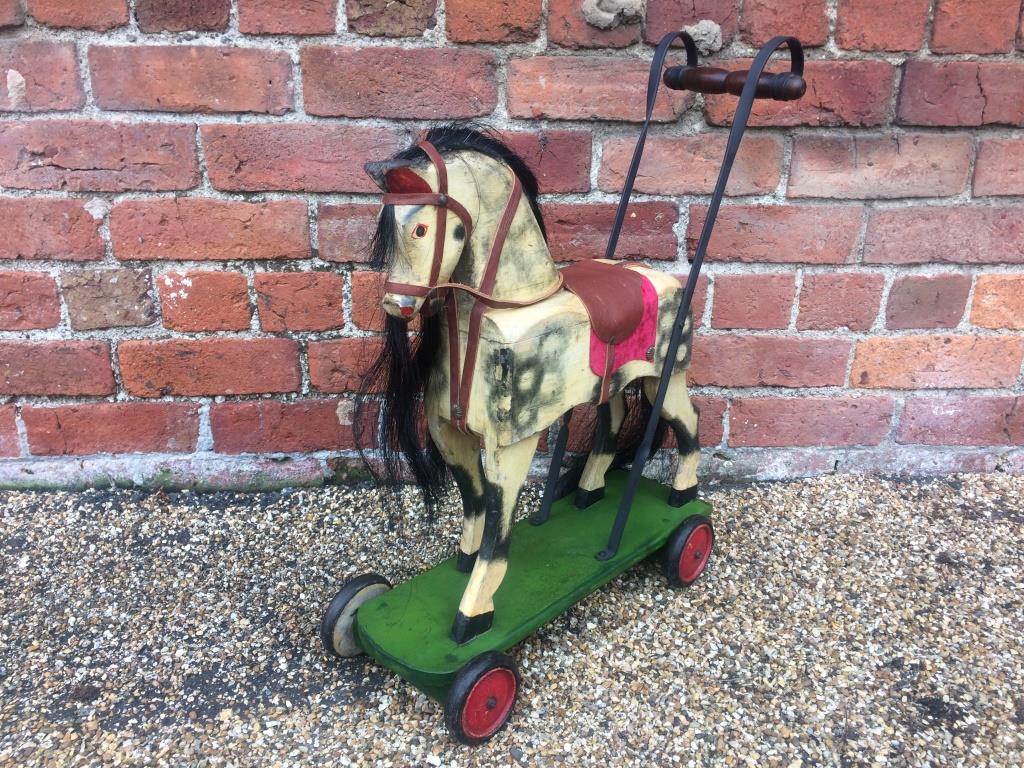 antique push along toy horse