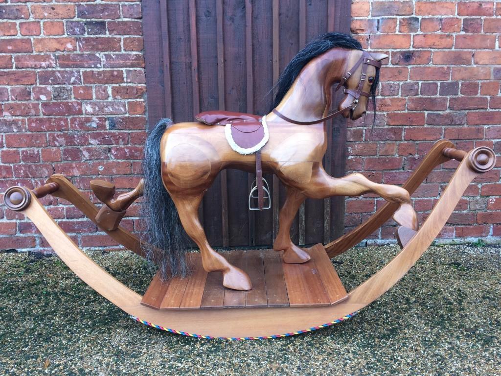 Large bow rocking horse, wood finish.