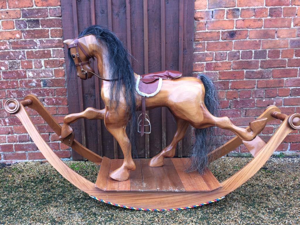 Bow rocking horse with varnished wood finish